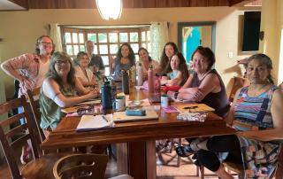 Writing retreat participants round a table